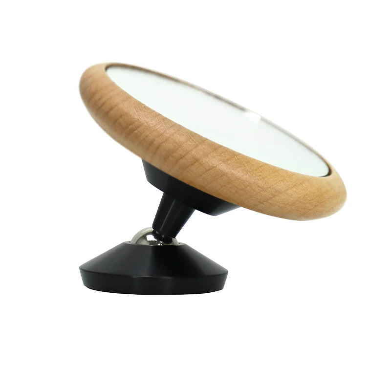 Wooden and black balance board on a white background