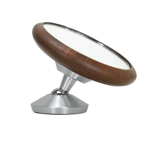 Round object with walnut wood top and silver base on a white background